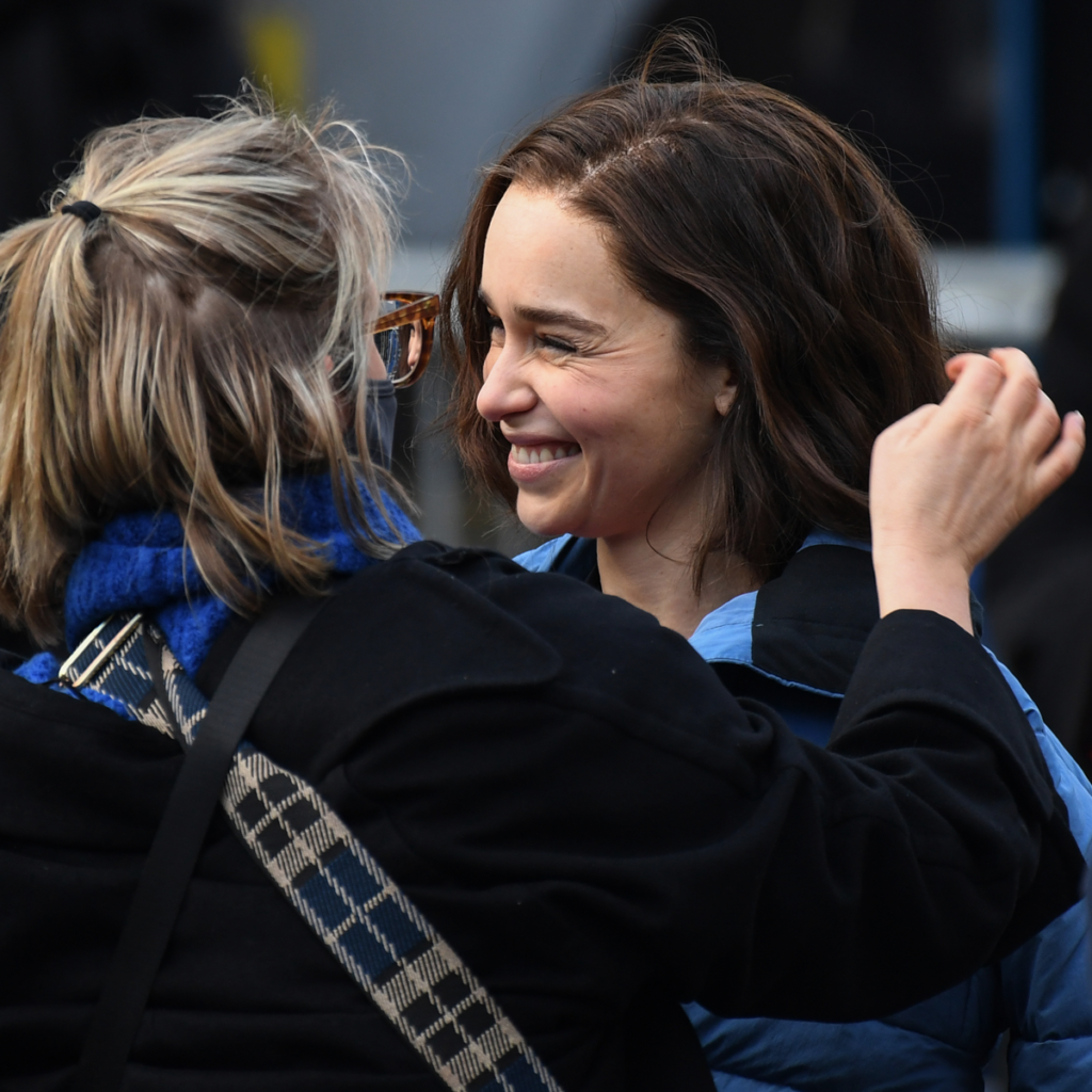 Emilia Clarke is pictured smiling.