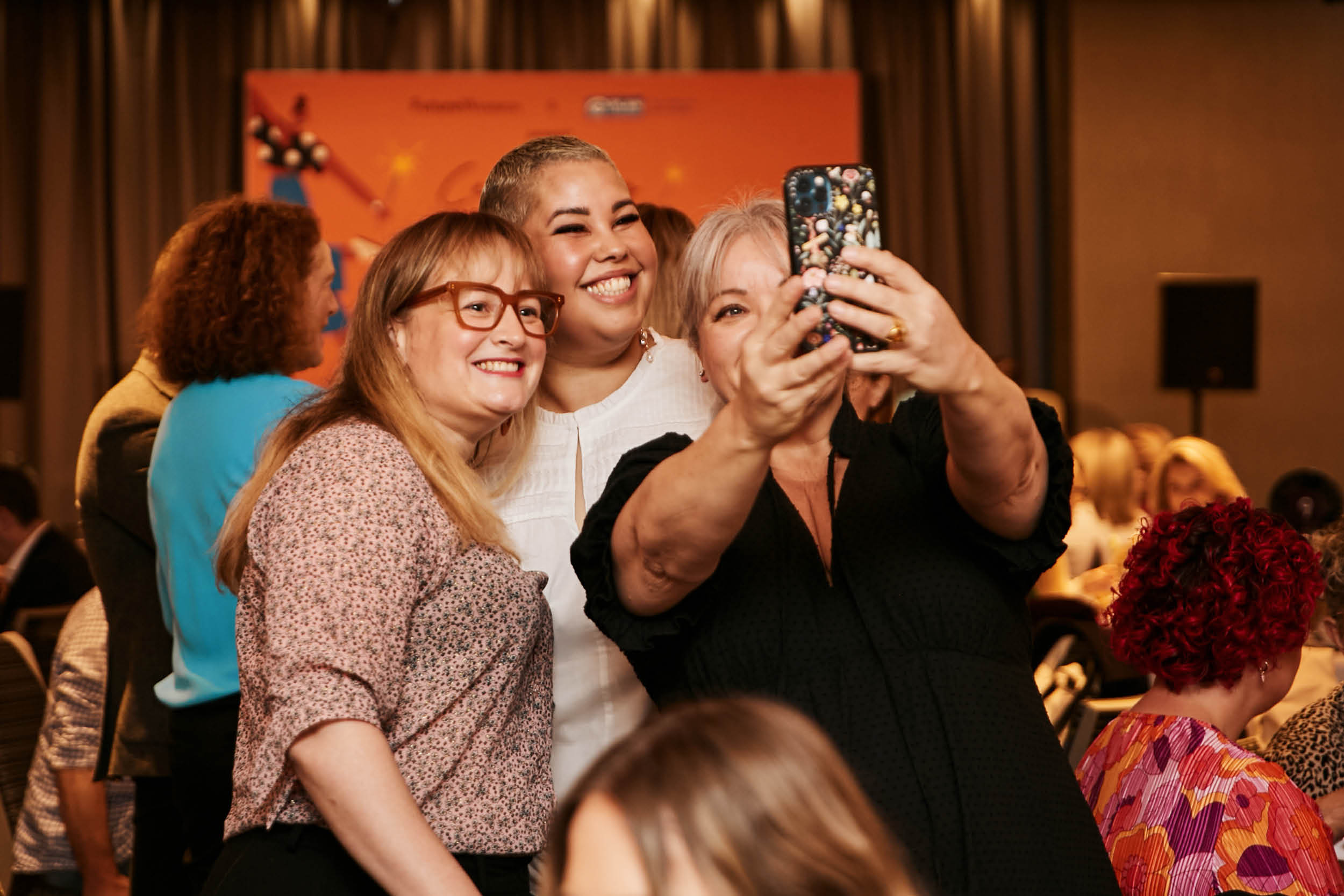 Guests posing with April Hélène-Horton at the event.